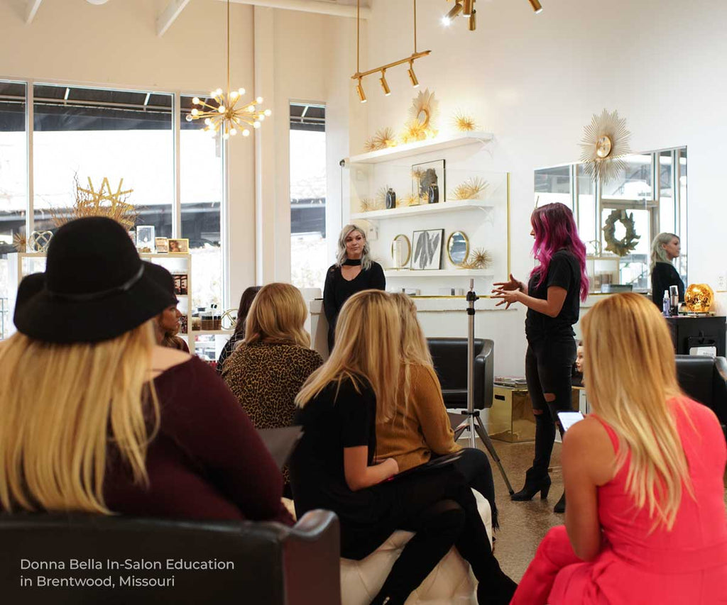 donna bella stylists educating in a salon